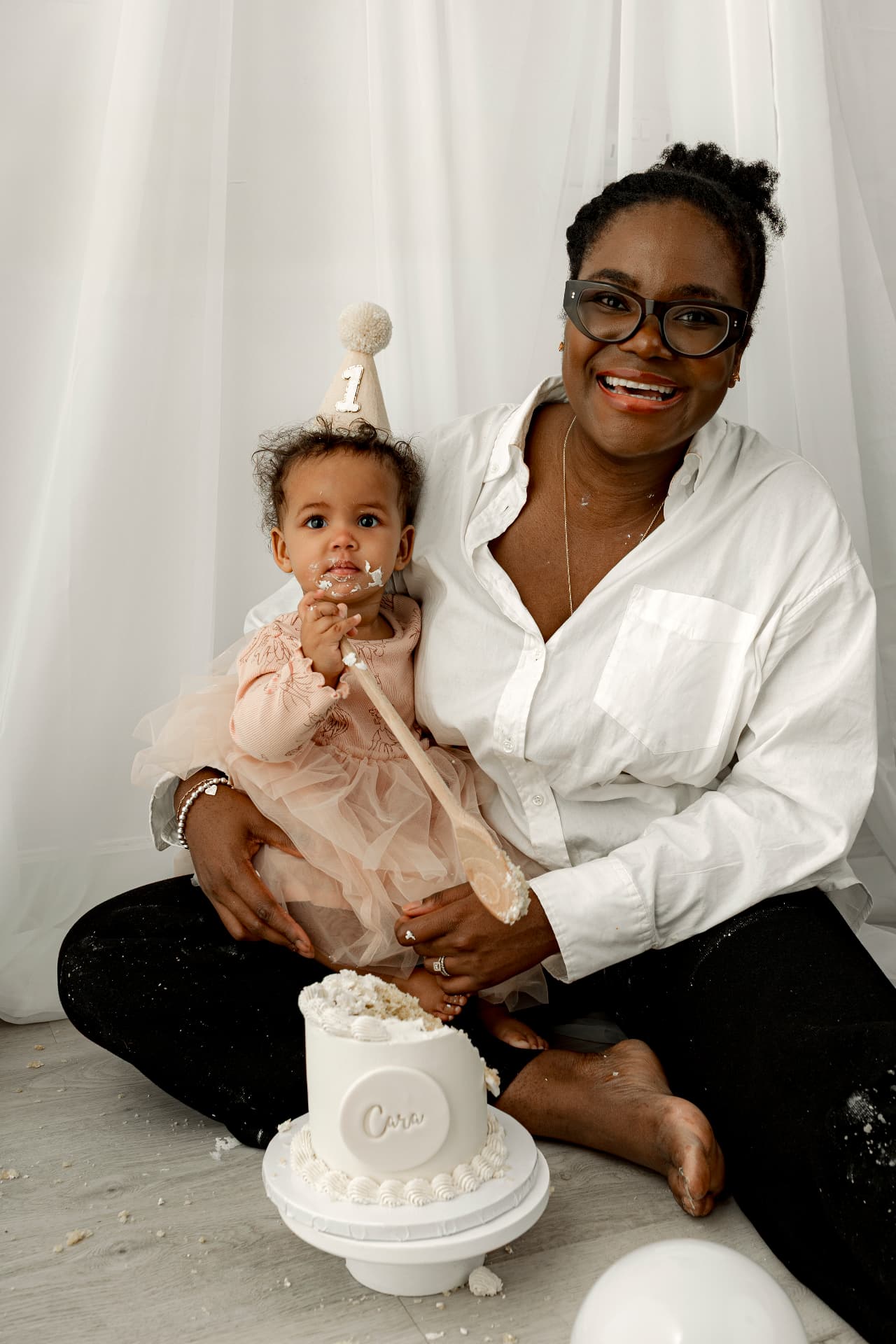 Chichi White with her daughter at a first birthday cake smash